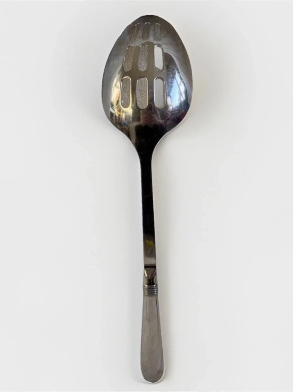 Oneida Mercutio Slotted Serving Spoon 18/8 Stainless Glossy Flared Tip